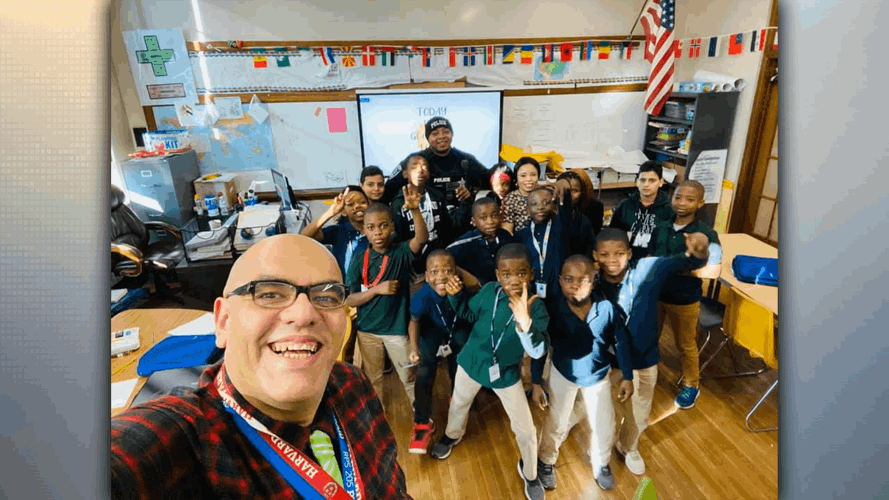 Mustafa Abdall and students in a classroom